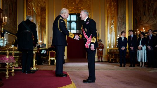 Admiral Sir Tony Radakin shakes hands with the King during his investiture ceremony at Windsor Castle