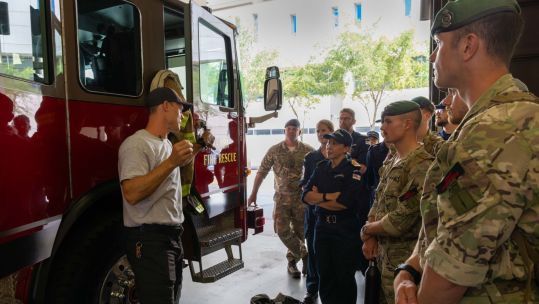 Personnel from HMS Trent are briefed in Tampa's fire rescue HQ (Picture: Royal Navy)