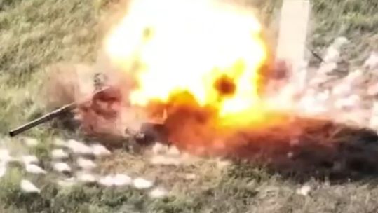 Russian Turtle tank being hit by a Ukrainian drone
