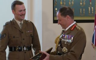 Cpl Luke O'Neill, of 1 Rifles, was presented with the first Fitzgibbon Award at Sandhurst