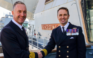 Captain Will Blackett handed over command of HMS Prince of Wales to Captain Ben Power