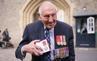Mervyn Kersh receiving BEM medals