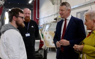 Mr Pollard (middle right) made the comments while visiting one of five newly announced defence technical excellence colleges