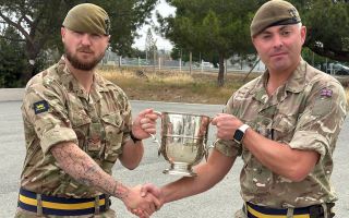 Corporal Archie Galbraith receives his well-deserved award - and a hearty handshake - from his CO, Lieutenant Colonel Alex Cherry (Picture: BFBS)