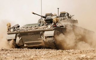 This Warrior from 1st Battalion, The Royal Welsh is being driven in some exceptionally dry conditions in the Drawsko Pomorskie training area in Poland, but needs to versatile enough to be driven in mud or snow as well (Picture: MOD)