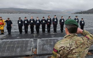 Sir Gwyn salutes the casing party and they return from their record breaking deployment