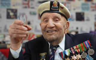 D-Day veteran Dougie Shelley seen celebrating his 100th birthday in 2025