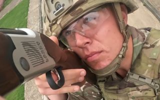 This RLC soldier is firing a laser shotgun - while on the move - at a fast-flying drone, training to counter the threat his unit might face in war (Picture: BFBS)