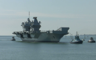 HMS Queen Elizabeth returns to Portsmouth after Scotland repairs CRED BFBS
