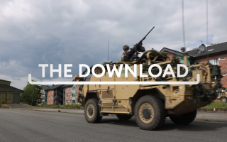 Armoured vehicle on street with Download graphic